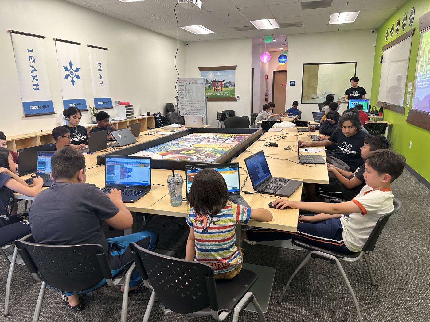 Inside the Code Ninjas Tracy center — kids building games with a Sensei